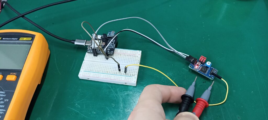 PCF8591 in a breadboard with a multimeter and ESP32