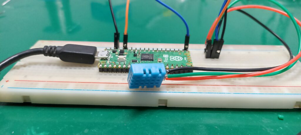 DHT11 on a breadboard with raspberry pi pico 2